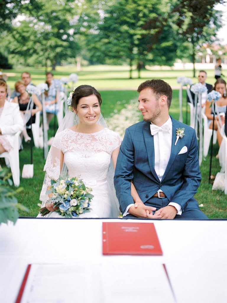 Bride and groom outdoor civil wedding ceremony in Schloss Neuhardenberg